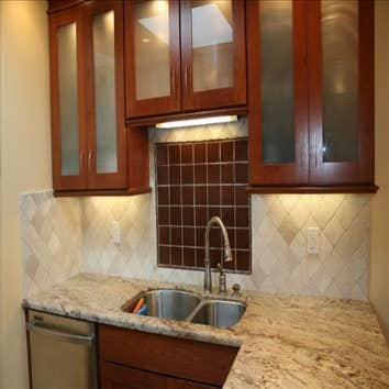 The Kitchen at Shea's Residence The existing space was poorly designed, frought with blind corner cabinets and dead spaces. Working with the client, we
