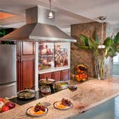 Oceanfront Condo Renovation Opening up the Kitchen allowed expansive ocean views while cooking and entertaining guests! A stunning Powder Room was also