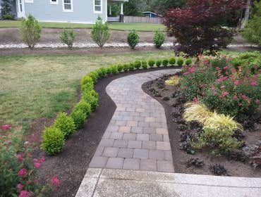 Photos by Rc Healthy Lawns #1 Full yard restoration pavers, retaining walls, vegetable gardens, flower beds, sod, shrugs ,plants and trees.