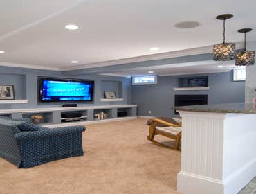 Montgomery County, MD Finished Basement Our basement finishing project in Olney, Maryland consisted of a built-in entertainment wall with storage cubbi