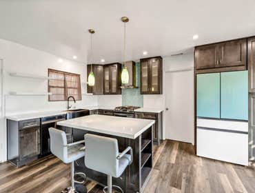 Photos by Golden Shore Design and Build #1 A mix of Smokey grey semi custom and custom kitchen cabinets,
Change of layout to have an open concept kitch