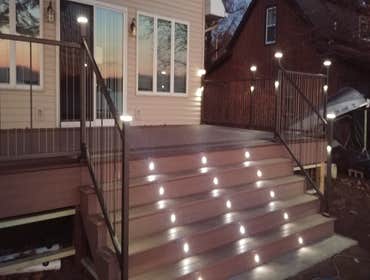Photos by Kwaske Construction Co #3 Replace treated lumber deck with PVC boards with aluminum and wire rails. Installed lighting system in posts and r
