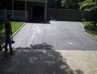 Asphalt driveway with pavers