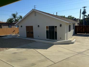 Exterior painted We transformed the home's exterior by changing the color from green to white. This project required priming all surfaces to ensure the