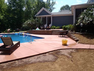 Clearwater Pools 20x40 2' Radius Swimming Pool in Gurley, AL. 20x40 Grecian with brick coping and stained concrete.