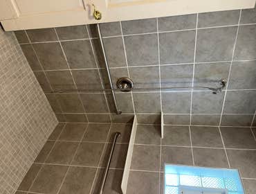 August 2023 Bathroom, backsplash, and porch roof