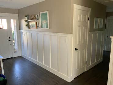 Trim & Wainscoting Applied wainscoting to entry and hall. Trimmed out windows and doors along with shiplap above fireplace mantle.