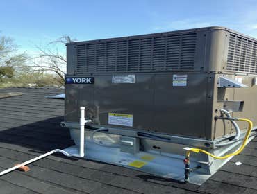 Condenser unit replacement on a flat roof