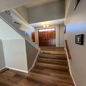 Photos by Infinite Floors & More #1 Heated floors, all new LVP throughout main level and lower level of home, new railings and custom stair system!