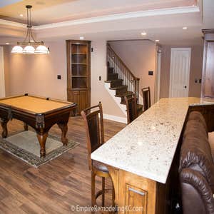 Deluxe Kitchen in Basement remodel with crawford ceilings, hidden doors, stone and granite bar, and living area. Deluxe Kitchen in Basement remodel...