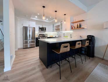 Photos by Lio James Construction Inc #5 Another Beautiful Project in Redondo Beach. Black & white shades with gold touches Custom kitchen cabinets, flo