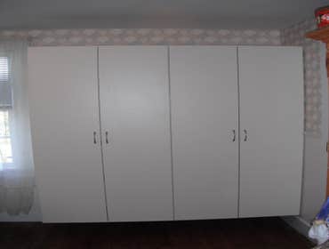 Stone House Remove cabinets and window, add wall closet to bedroom, install sliding door, tile on inside of slider, add secound story deck to front of 
