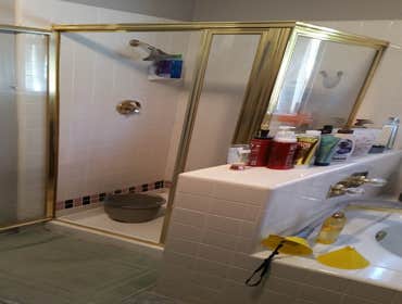 Photos by Dutch Dynasty Construction Relocate tub, walk in shower with no door, new vanity, ventilation fans, recessed lights, replace arch entry with 