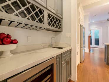 7631 Hampson St. Stunning conversion from a single shotgun to a 2500 sq. ft. camelback located off of St. Charles