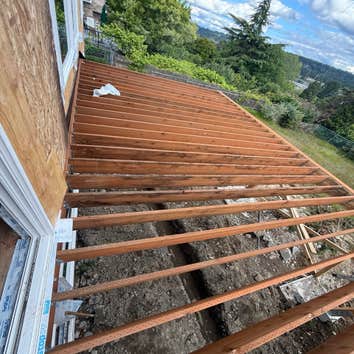 Deck & Outdoor living Complete structural deck framing for a residential outdoor living area. Scope included layout, beam and joist installation, fram