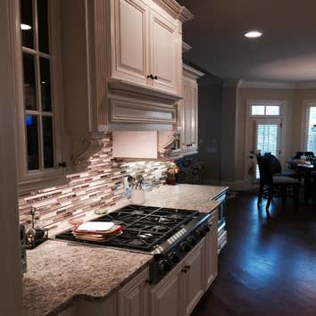 R Project Whole house remodel with a large kitchen remodel that required structural changes. Finished flooring, cabinets, countertops, relocation of 