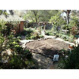 La Crescenta French Intensive Garden 12'x10' garden with rock borders and drip line irrigation system ready for seeding.