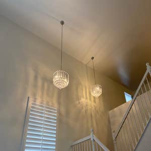 Photos by Cj’s Electrical Company Inc #2 Change out Chandeliers 22 feet high and One in the Kitchen