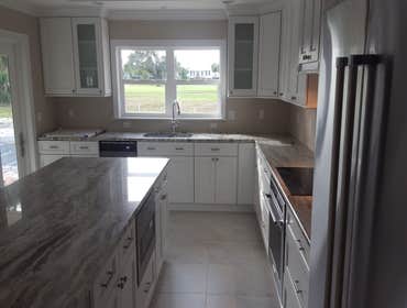 Photos by Cosmopolitan Construction and Maintenance Kitchen and Bathroom remodel