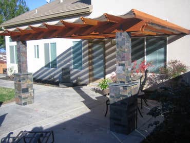 Redwood Trellis with Slate pillars Shaded Trellis with slate pillars. All of this slate was from 12x12 slate cut down to sizes in increments of 2", thi