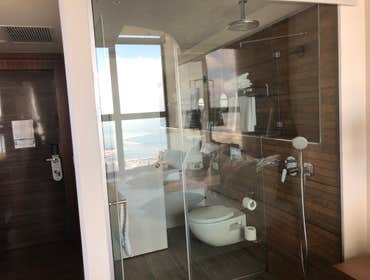 clear glass from walk in shower wall to badroom view Clear wall between bathroom/walk-in shower to bedroom to take advantage of the view from window