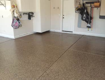Champion Decor And Coatings LLC Garage floor with full broadcast vinyl chip, polyaspartic topcoat.