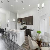 Photos by Luxar Homes #2 We LOVE a good contrast in a home! The dark cabinets and flooring really bring out the beautiful details in our Quartz counter