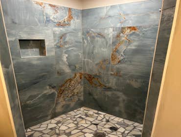 Polished porcelain large format shower project