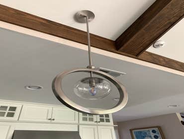 Fan Install- Modern New Construction Homes Installation of a non-standard fan in a new construction home. Installation of light fixtures.