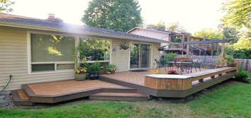 Project photos from Jbs Art Decko Trex deck with planters and swing.