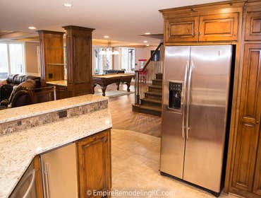 Deluxe Kitchen in Basement remodel with crawford ceilings, hidden doors, stone and granite bar, and living area. Deluxe Kitchen in Basement remodel wit