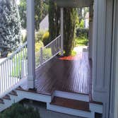 Photo(s) from Moon Painting Service And Finishes Catching paint chips over high-end landscaping