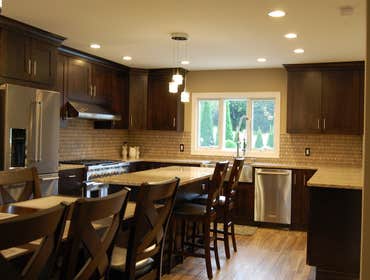 Kitchen remodel To expand this kitchen, the load bearing kitchen/dining room partition wall was removed. A steel beam was installed in the ceiling to c