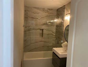 Photos by Pan Shi Construction Inc #1 Converted an existing garage into a fully functional Accessory Dwelling Unit (ADU), The project included framing 