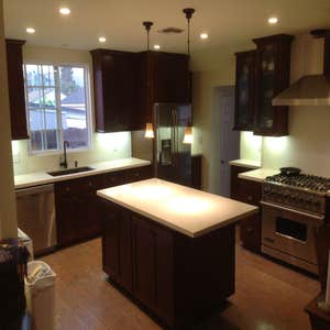 Trusted Respected Unique Construction Inc Project Before and after photos of a kitchen remodel