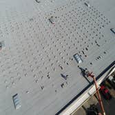 Fork Lifting Material to Roof