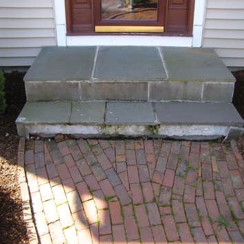 Bluestone Faced Concrete Step Repair Simmons Masonry repaired the bluestone veneer risers to the entryway step on the front of this home. To do so, Gr
