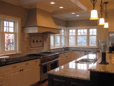A kitchen/living room remodel in Edina Mn Enamled all cabinets, windows and wood trim. Painted all walls and ceilings.
