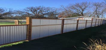 Corrugated steel privacy fencing