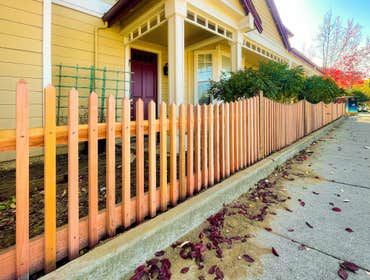 Inverted Arch Fence with Hand Cut 2×2 Pickets