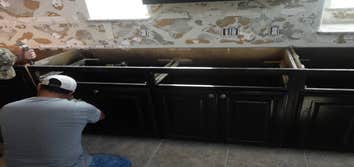 Cabinet repair after water damage Cabinets damage by water, repaired them than refinished all so they looked the same.