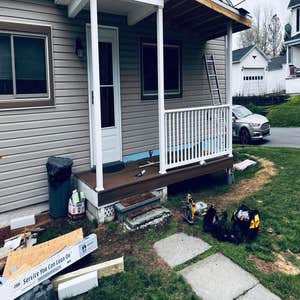Photos by Reaper Junk Removal Services #4 Add additional porch with new roof,supports,trex decking and vinyl railings to match.