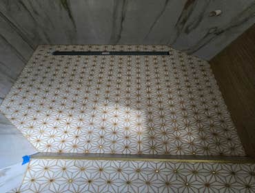 Photos by MC ALISTER TILE #1 5 showers total, was hired after another handyman did not water proof correctly, fixed all water proofing and installed 