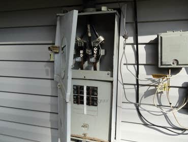 Project photos from Echols Home Inspections Old Knob n Tube wiring.
Damaged Electrical Panel
Slight Water Intrusion
Beer Can Hot Water Heater Flue (N