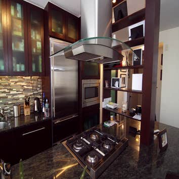 Kitchen and Livingroom remodl by Elite Architectural Remodeling Co Complete remodel with custom cabinets, shelves, doors. All woodwork designed and cre
