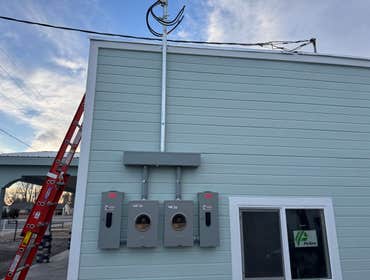 Photos by Mountain Range Electric LLC #1 Two electrical service upgrades with new 150 amp panel for the house and a 150 amp panel for the autobody shop