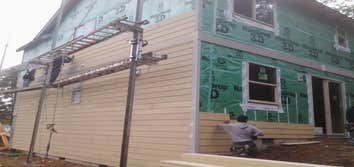 Triton Construction LLC Projects window house wrap and lap hardy installations
