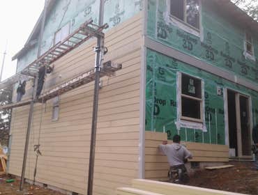 Triton Construction LLC Projects window house wrap and lap hardy installations
