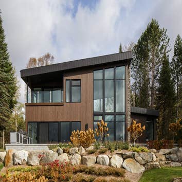 Project 15-461 The interior layout and large windows in this custom home provide the occupants a stunning views on the lake and mountains of this regi