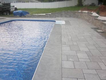 Photos by Dunn Landscape Construction #1 After initial pool installation provide all hardscape including retaining walls, pool deck, walkways and plant
